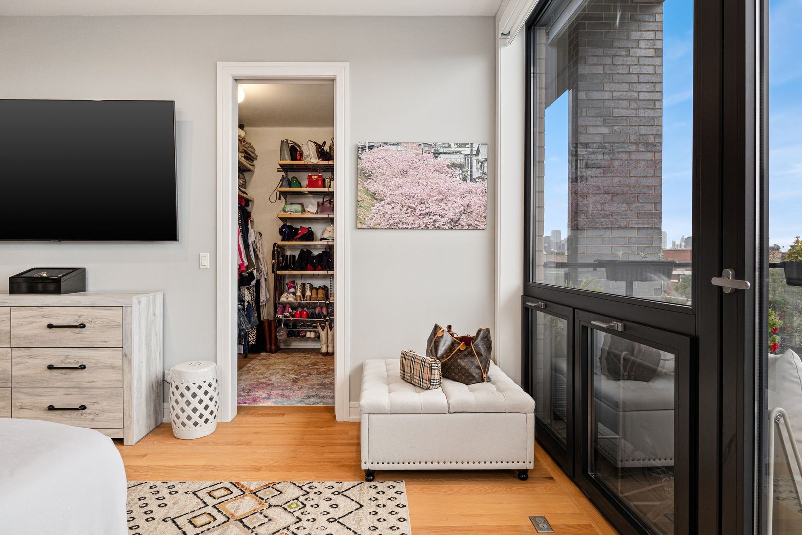 2116 West Chicago Avenue, Unit 3W Chicago, IL 60622 - Photo 21 of 37 a living room with furniture and a flat screen tv