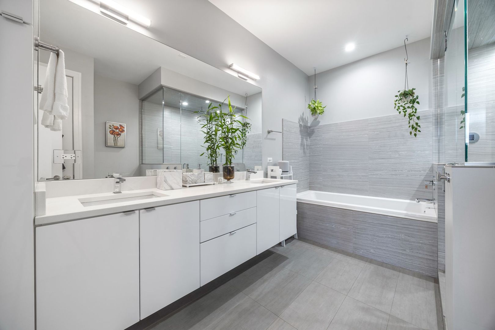 2116 West Chicago Avenue, Unit 3W Chicago, IL 60622 - Photo 23 of 37 a bathroom with a double vanity sink and a bathtub