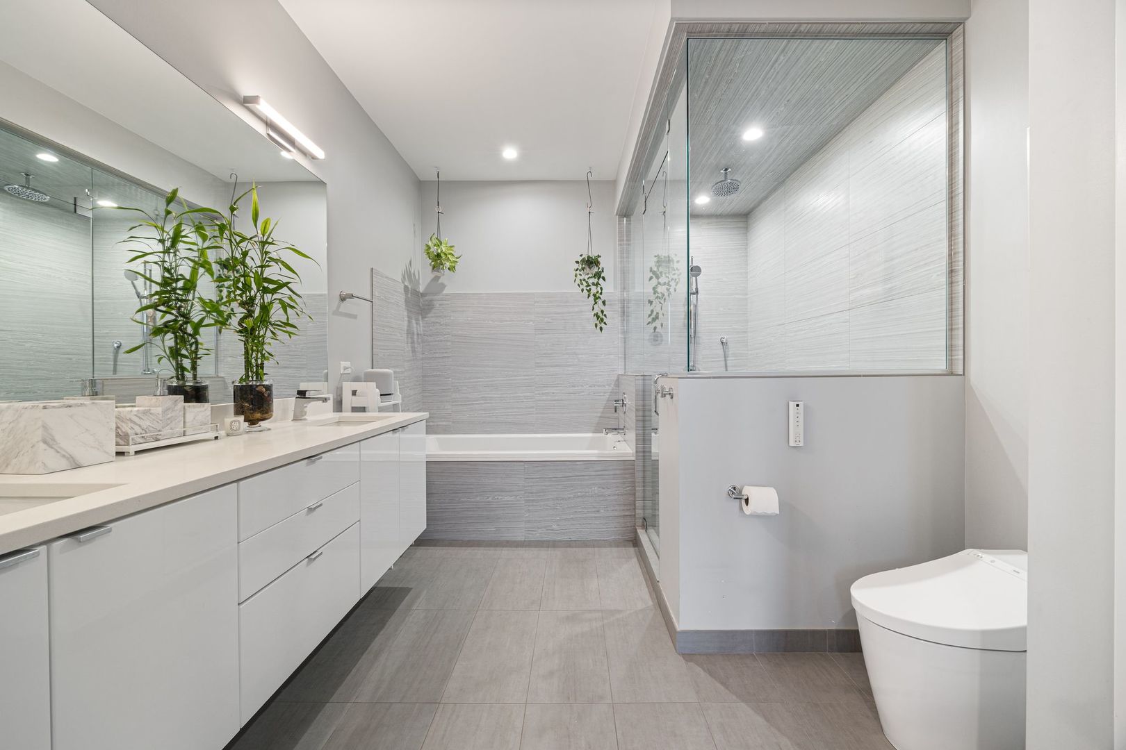2116 West Chicago Avenue, Unit 3W Chicago, IL 60622 - Photo 24 of 37 a bathroom with a double vanity sink toilet and shower