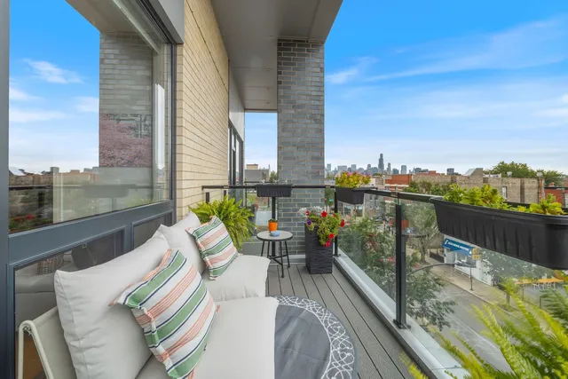 a bedroom with a large bed and a potted plant