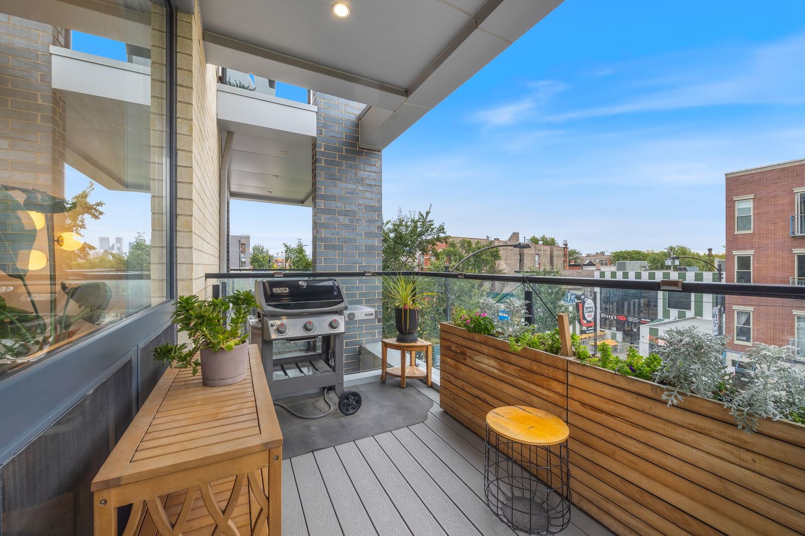 2116 West Chicago Avenue, Unit 3W Chicago, IL 60622 - Photo 4 of 37 a view of a balcony with two chairs and a potted plant