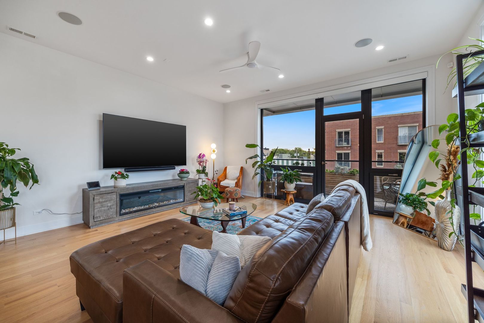 2116 West Chicago Avenue, Unit 3W Chicago, IL 60622 - Photo 7 of 37 a living room with furniture and a flat screen tv