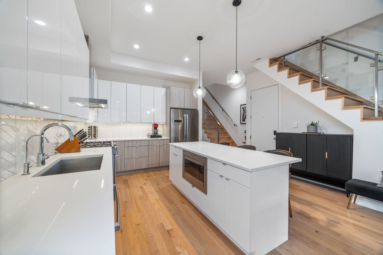 2116 West Chicago Avenue, Unit 3W Chicago, IL 60622 - Photo 9 of 37 a view of kitchen with stainless steel appliances sink stove and cabinets