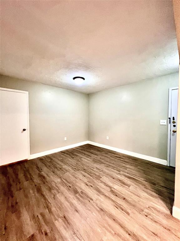 7000 Northwest 17th Street, Unit 109 Plantation, FL 33313 - Photo 12 of 21 a view of empty room with wooden floor