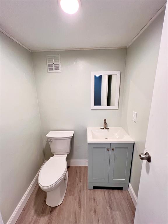 7000 Northwest 17th Street, Unit 109 Plantation, FL 33313 - Photo 18 of 21 a bathroom with a toilet a sink and mirror