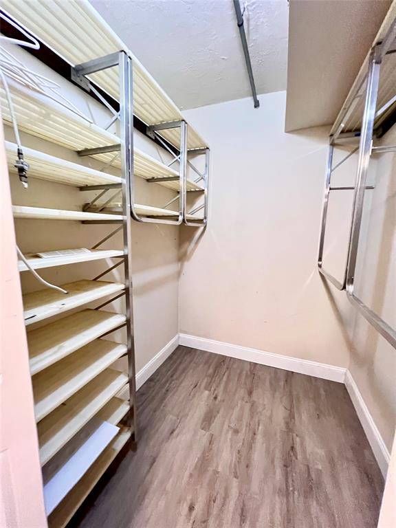 7000 Northwest 17th Street, Unit 109 Plantation, FL 33313 - Photo 19 of 21 a view of walk in closet with empty racks