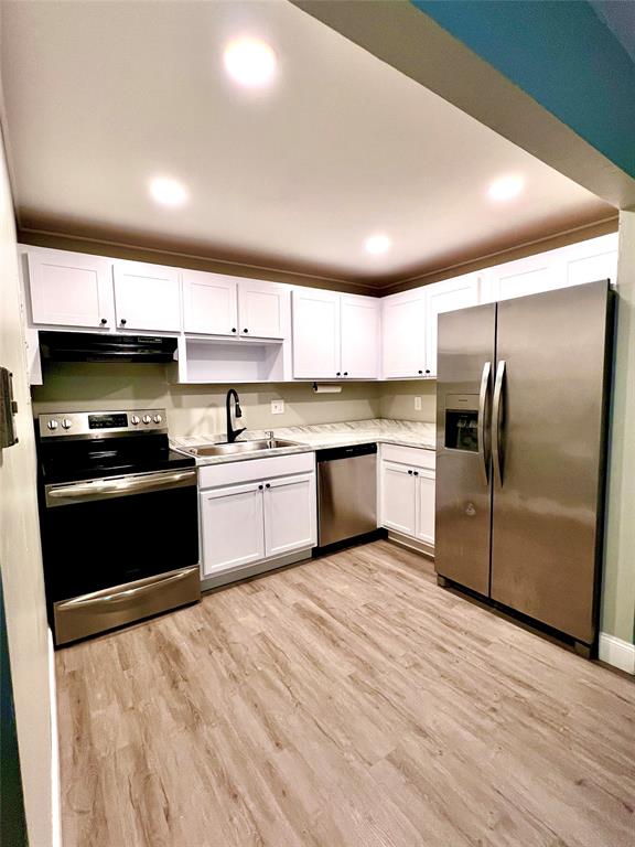 7000 Northwest 17th Street, Unit 109 Plantation, FL 33313 - Photo 9 of 21 a kitchen with a refrigerator sink and cabinets