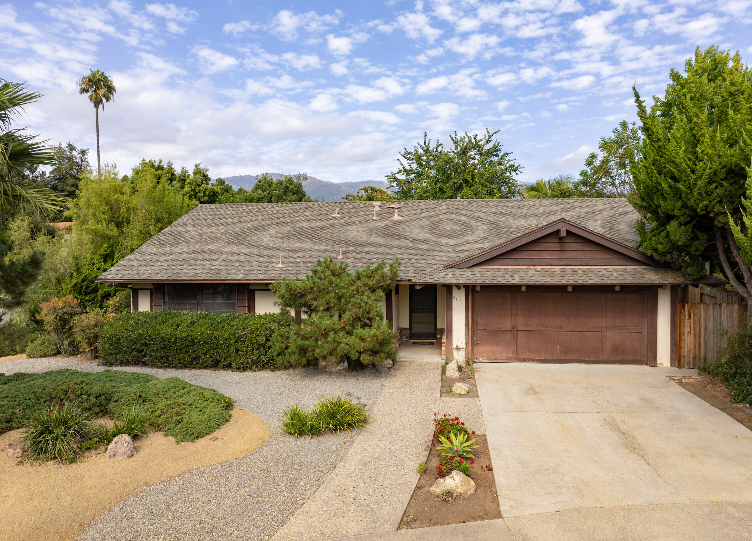 a house view with a garden space