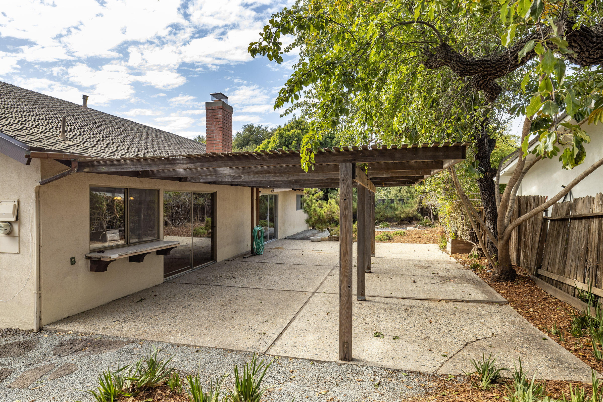 5121 Walnut Park Drive Santa Barbara, CA 93111 - Photo 14 of 23 a front view of a house with a garden