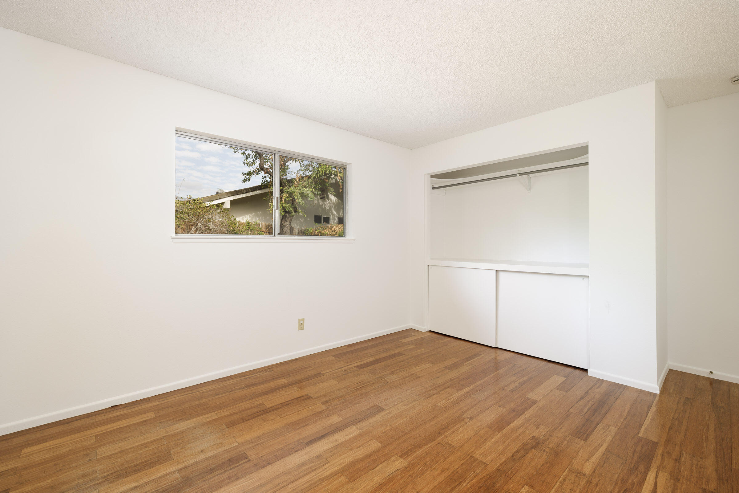 5121 Walnut Park Drive Santa Barbara, CA 93111 - Photo 22 of 23 an empty room with wooden floor and window