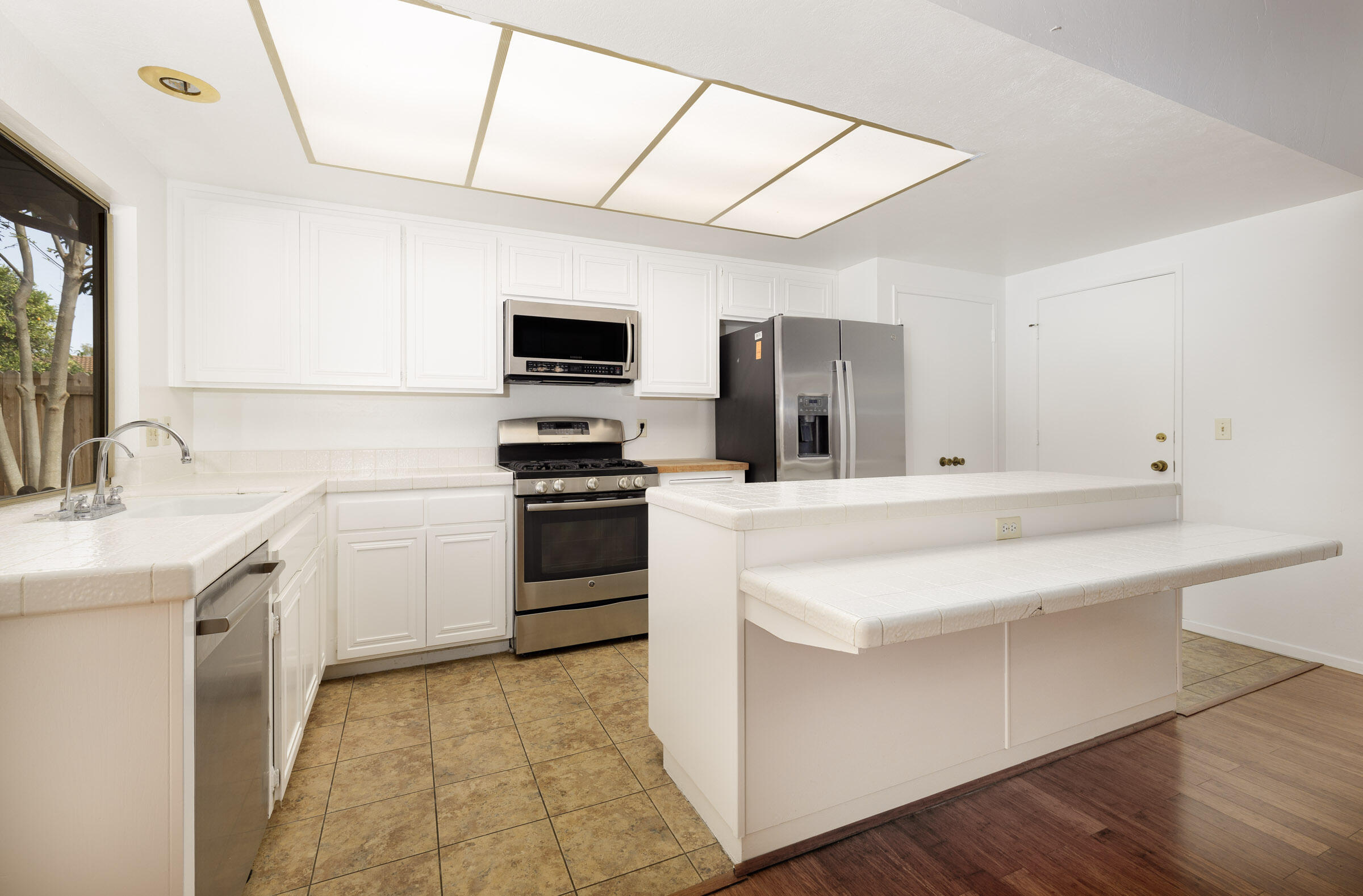 5121 Walnut Park Drive Santa Barbara, CA 93111 - Photo 8 of 23 a kitchen with a sink appliances and cabinets