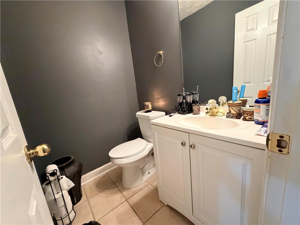426 Pates Lake Court Hampton, GA 30228 - Photo 53 of 60 a bathroom with a sink mirror and toilet