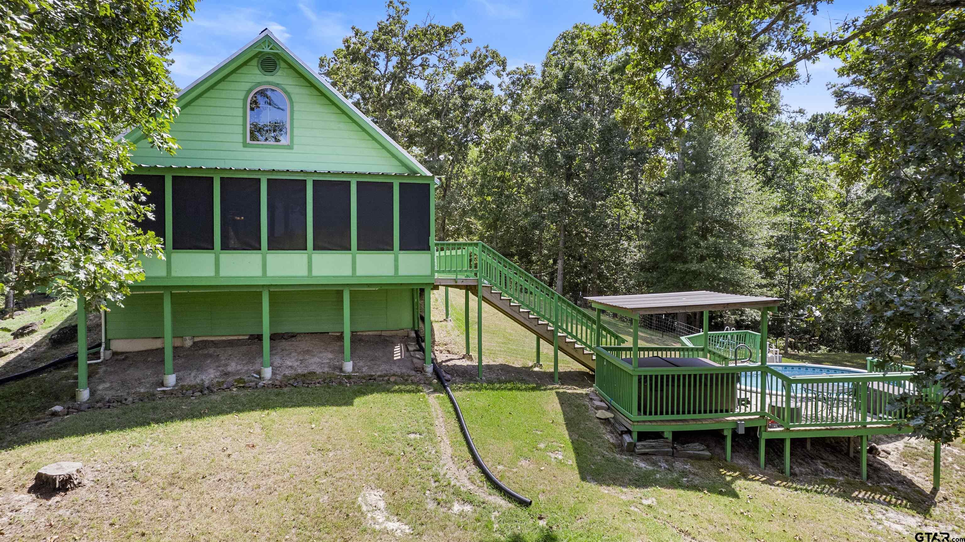 5066 Bob O Link Road Gilmer, TX 75645 - Photo 2 of 34 a view of house with a swimming pool