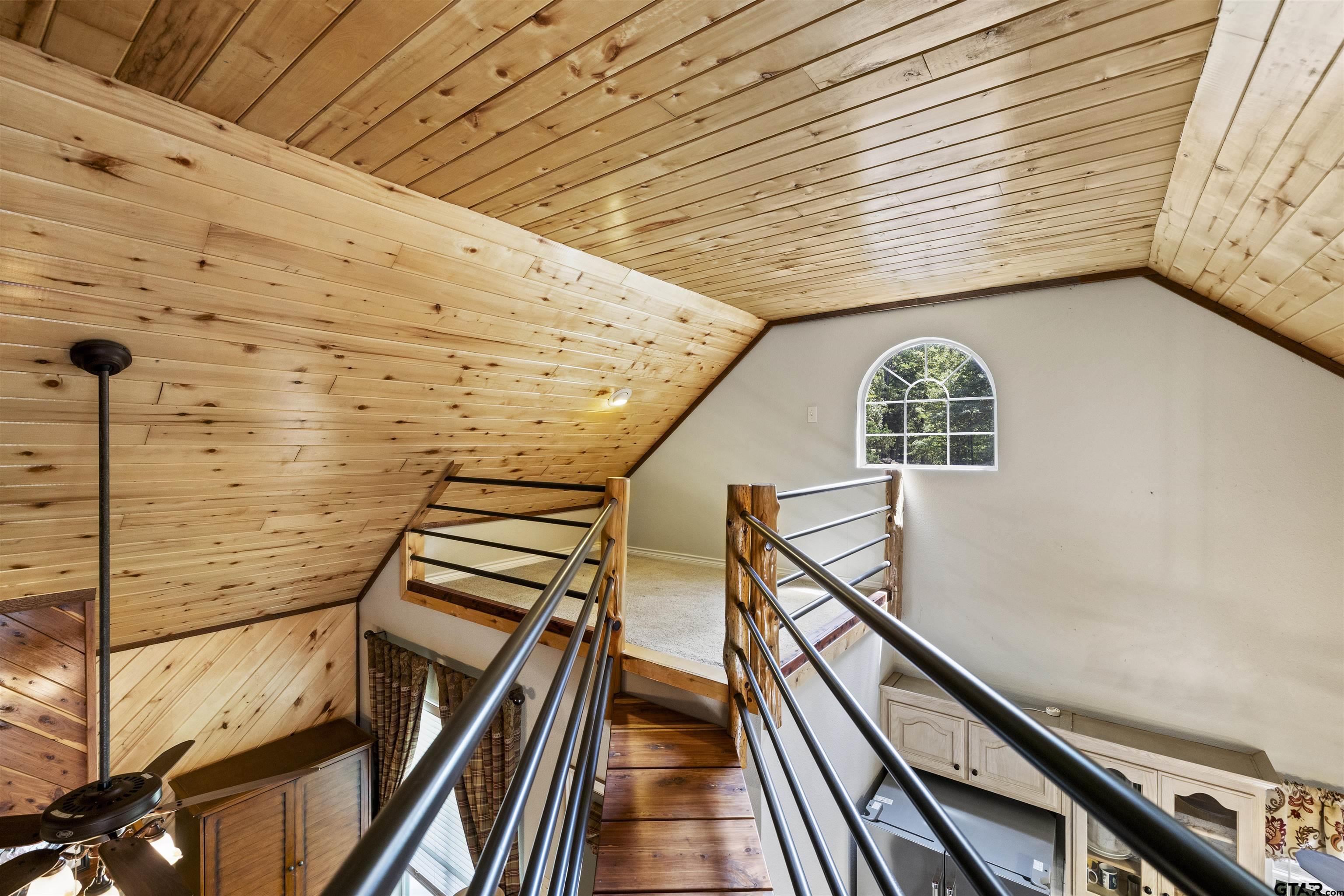 5066 Bob O Link Road Gilmer, TX 75645 - Photo 22 of 34 a view of wooden floor with staircase