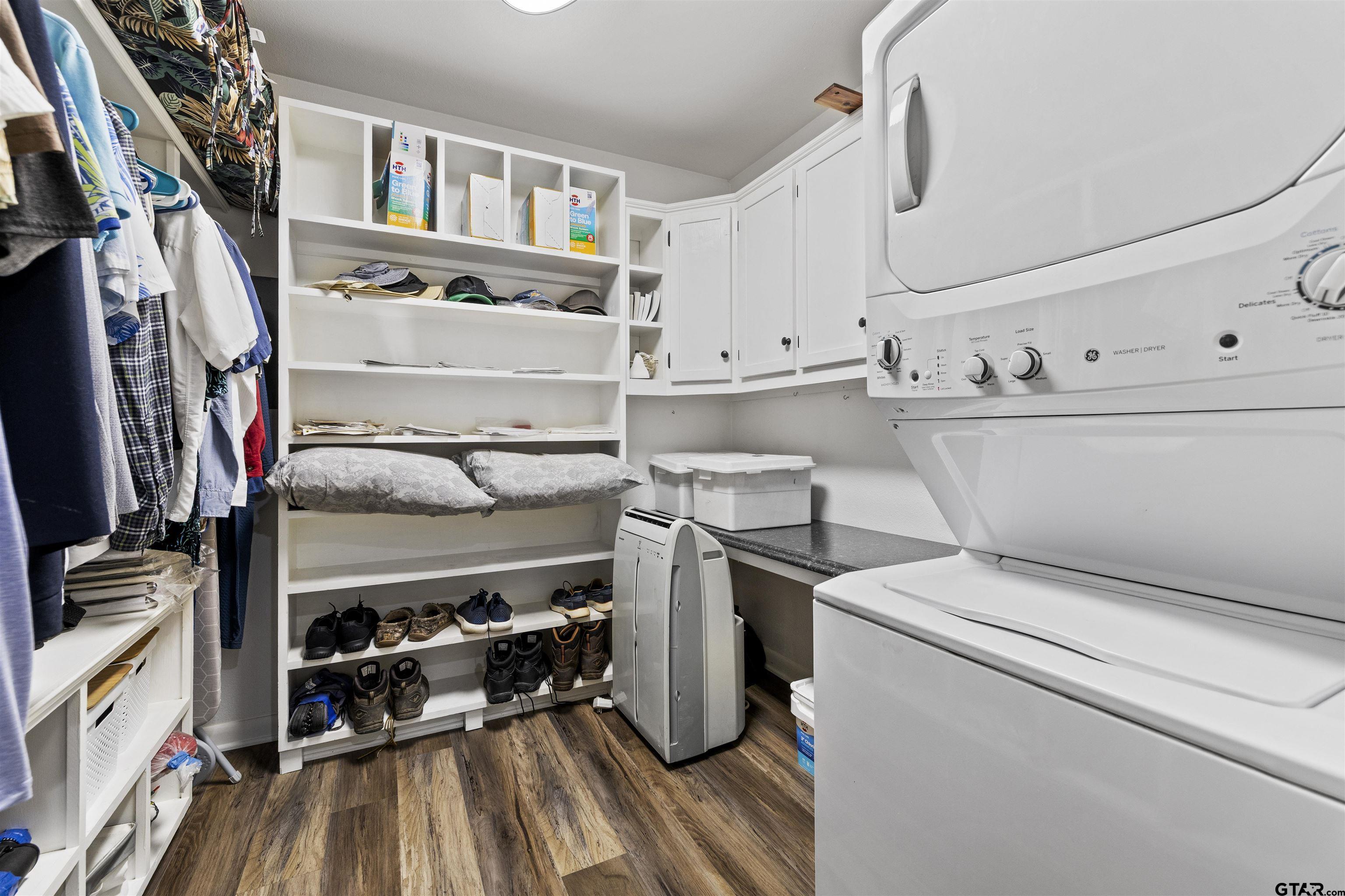 5066 Bob O Link Road Gilmer, TX 75645 - Photo 26 of 34 a view of storage and utility room with washer and dryer