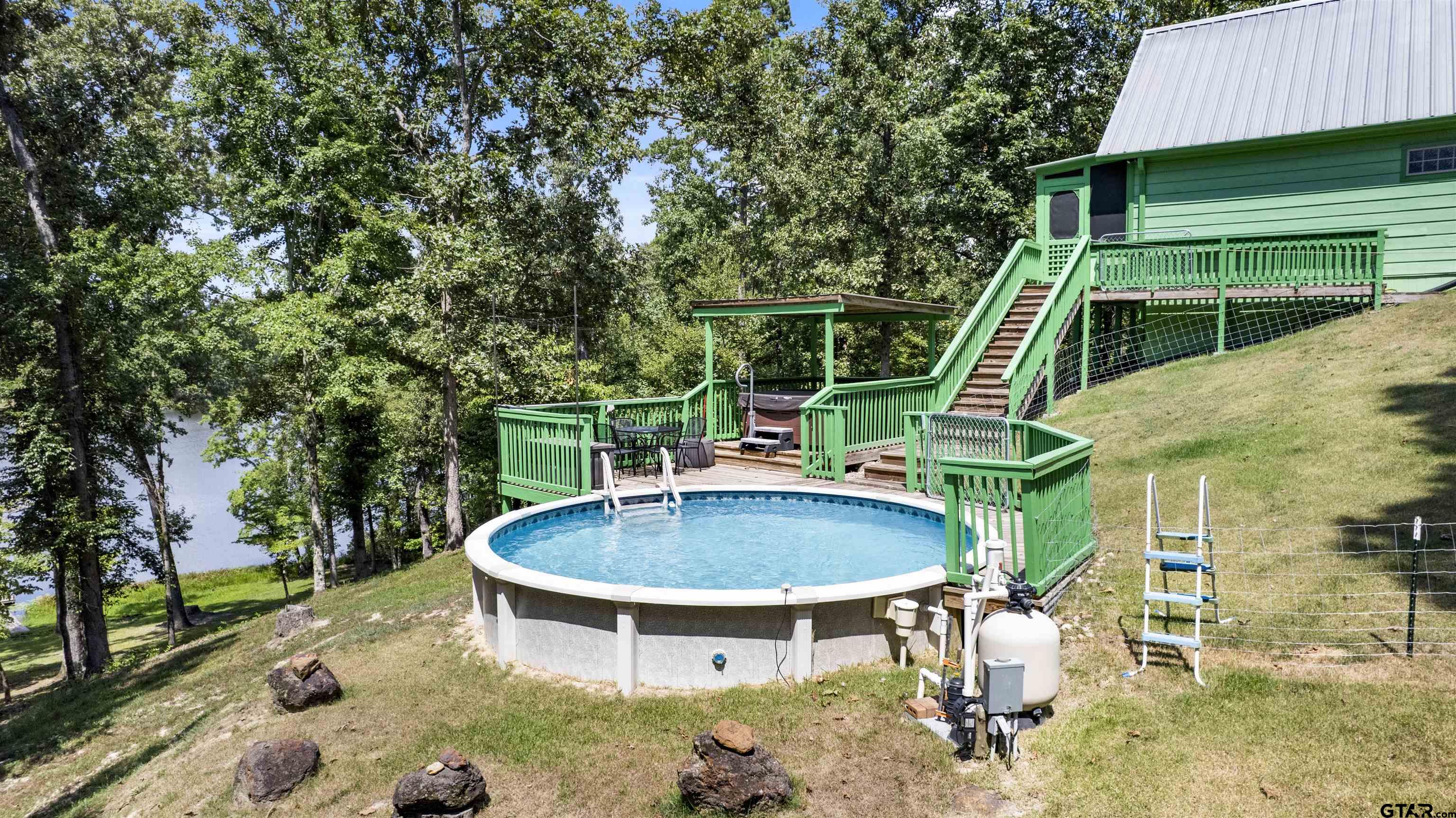 5066 Bob O Link Road Gilmer, TX 75645 - Photo 4 of 34 a view of backyard with swimming pool and outdoor seating