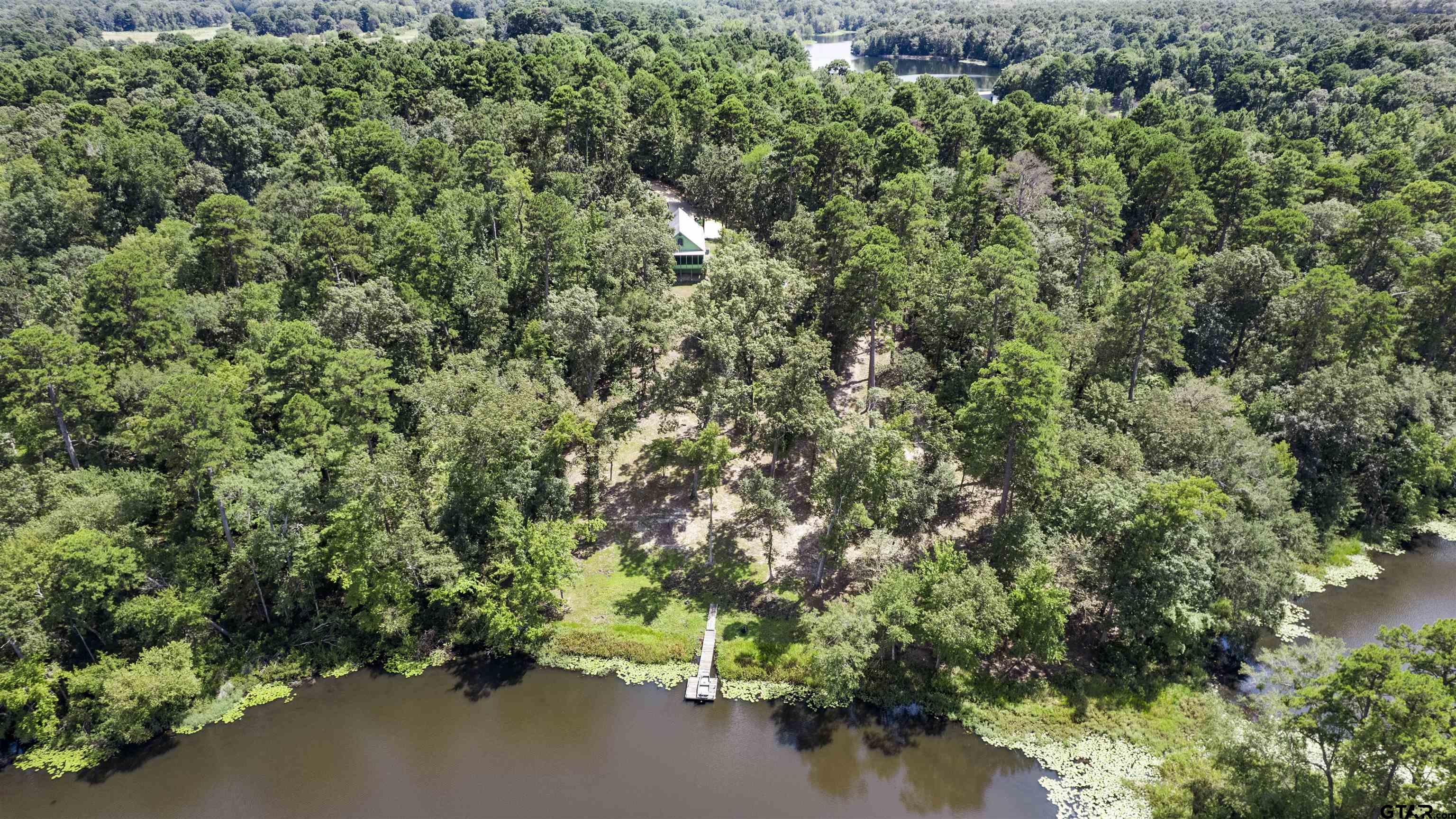5066 Bob O Link Road Gilmer, TX 75645 - Photo 7 of 34 an aerial view of a houses with yard and outdoor space