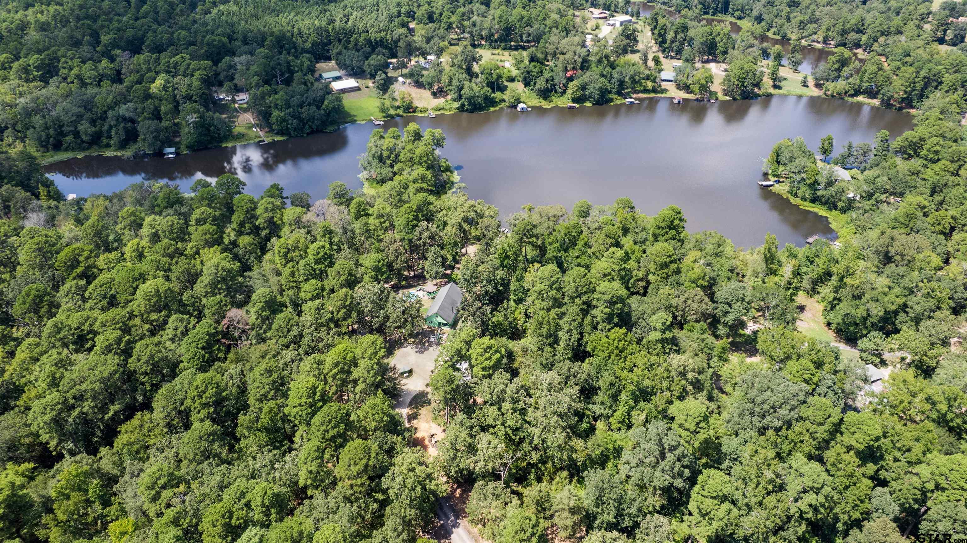 5066 Bob O Link Road Gilmer, TX 75645 - Photo 8 of 34 an aerial view of a house with a yard and lake view
