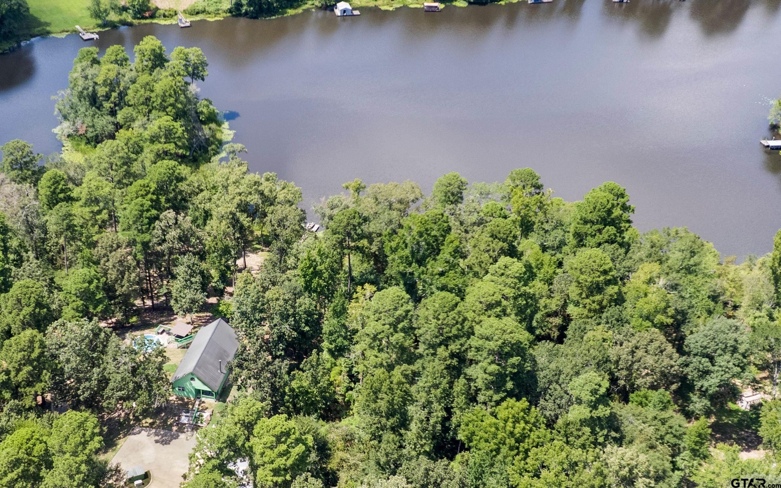 5066 Bob O Link Road Gilmer, TX 75645 - Photo 9 of 34 an aerial view of a house with a yard and lake view
