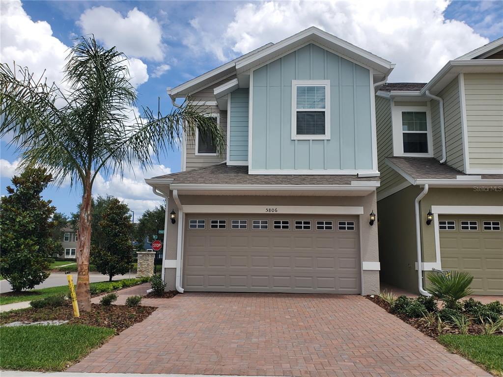 5806 Spotted Harrier Way Lithia, FL 33547 - Photo 1 of 1 a view of house with outdoor space and trees