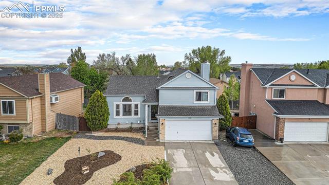 5085 Victory Road Colorado Springs, CO 80911 - Photo 3 of 18 Beautifully maintained and professionally landscaped front yard