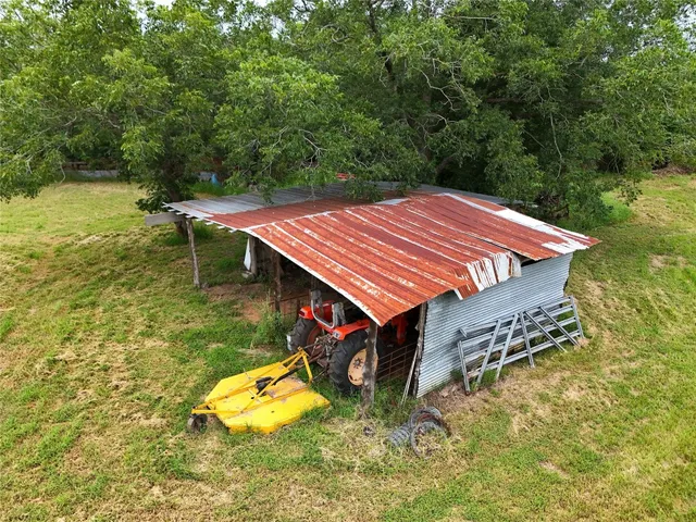 a view of a house with a yard porch and sitting area