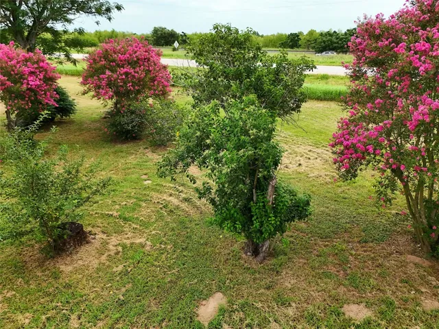an aerial view of residential house with swimming pool