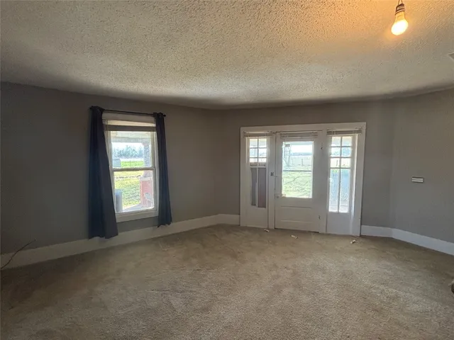 an empty room with windows