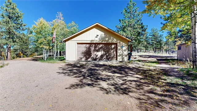 a view of outdoor space with wooden deck and tree