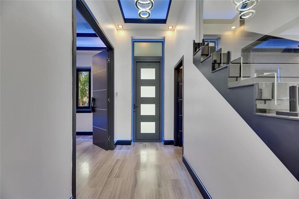 6528 Simone Shores Circle Apollo Beach, FL 33572 - Photo 17 of 98 a view of a hallway with wooden floor and staircase