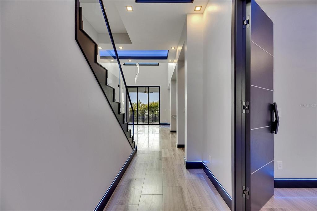 6528 Simone Shores Circle Apollo Beach, FL 33572 - Photo 22 of 98 a view of a hallway with wooden floor and staircase