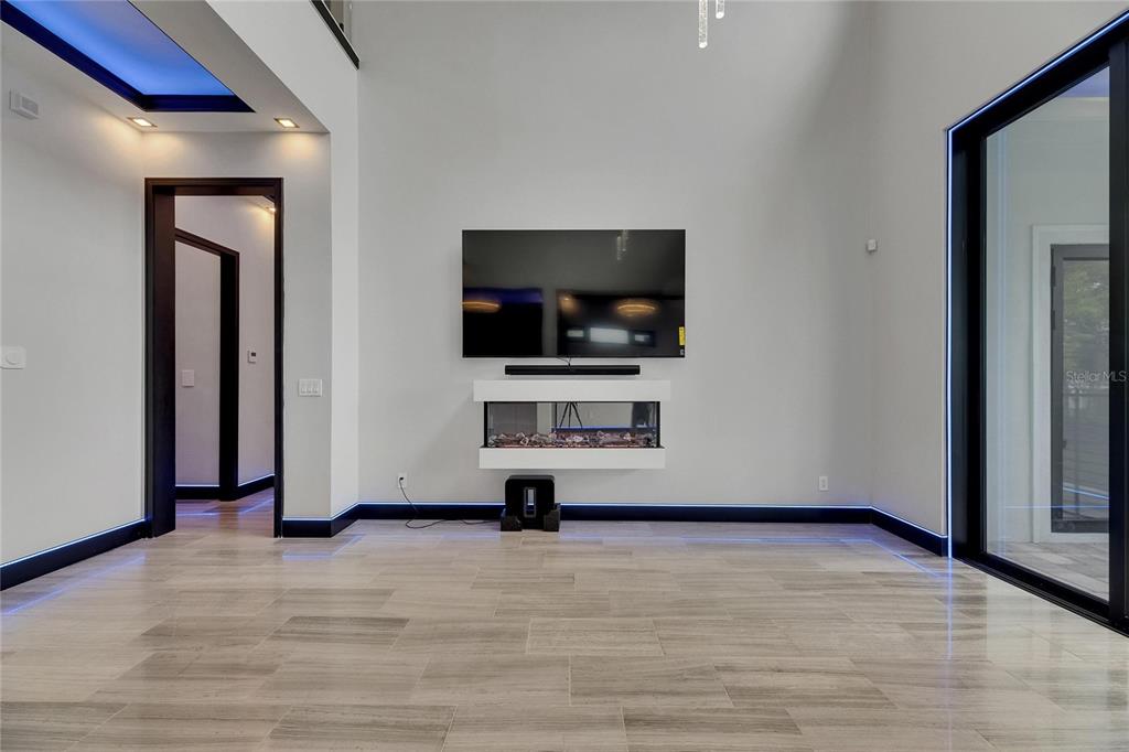 6528 Simone Shores Circle Apollo Beach, FL 33572 - Photo 30 of 98 a view of a livingroom with wooden floor and a flat screen tv