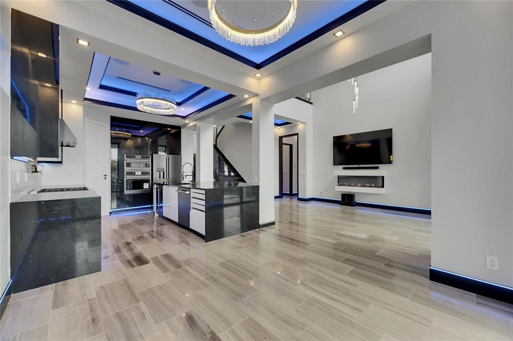 6528 Simone Shores Circle Apollo Beach, FL 33572 - Photo 33 of 98 a view of a living room a flat screen tv and kitchen view