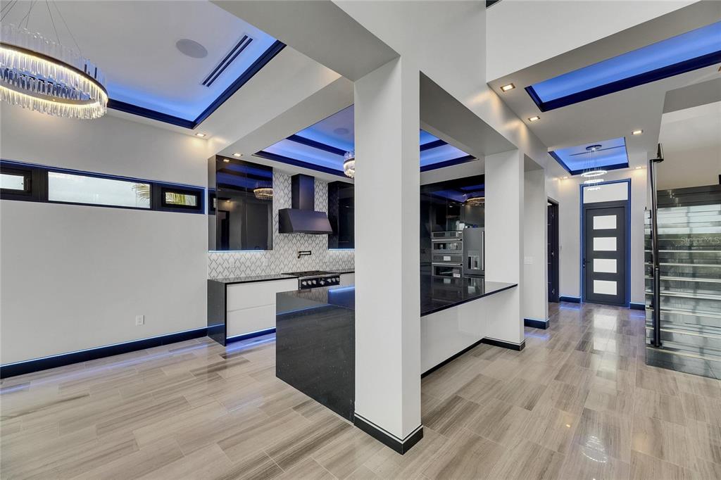 6528 Simone Shores Circle Apollo Beach, FL 33572 - Photo 35 of 98 a kitchen with stainless steel appliances granite countertop a stove and a refrigerator