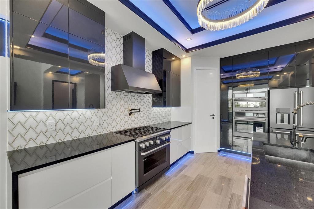 6528 Simone Shores Circle Apollo Beach, FL 33572 - Photo 38 of 98 a large kitchen with stainless steel appliances granite countertop a lot of counter space and a sink