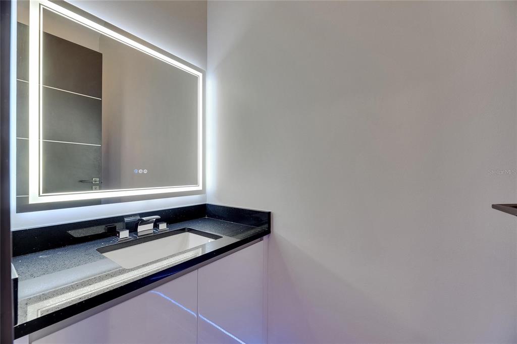 6528 Simone Shores Circle Apollo Beach, FL 33572 - Photo 53 of 98 a bathroom with a sink and a mirror