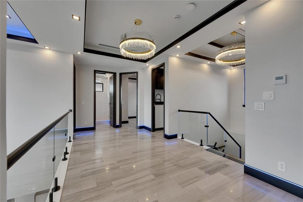 6528 Simone Shores Circle Apollo Beach, FL 33572 - Photo 59 of 98 a view of a hallway with wooden floor