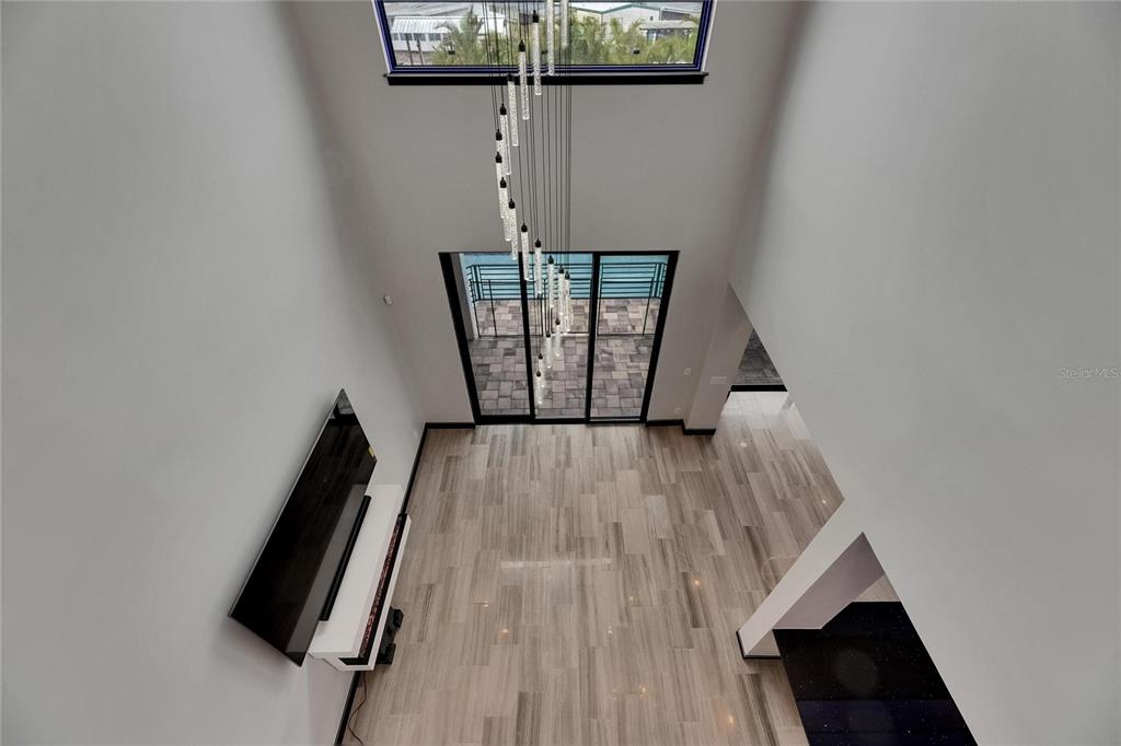 6528 Simone Shores Circle Apollo Beach, FL 33572 - Photo 62 of 98 a view of a hallway with wooden floor and staircase