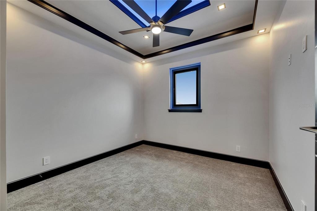 6528 Simone Shores Circle Apollo Beach, FL 33572 - Photo 65 of 98 an empty room with a ceiling fan and a window