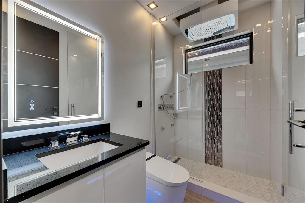 6528 Simone Shores Circle Apollo Beach, FL 33572 - Photo 67 of 98 a bathroom with a granite countertop sink toilet and shower