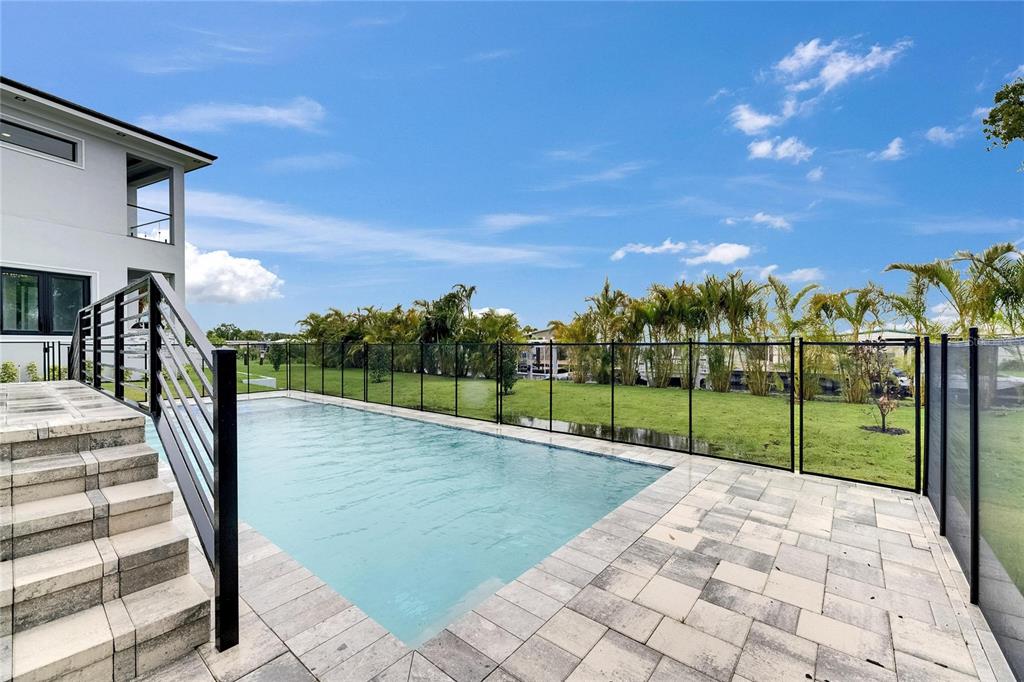 6528 Simone Shores Circle Apollo Beach, FL 33572 - Photo 86 of 98 a view of a balcony with wooden floor and iron fence
