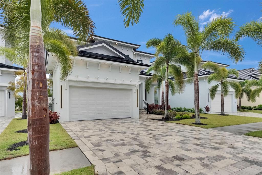 6528 Simone Shores Circle Apollo Beach, FL 33572 - Photo 9 of 98 a front view of a house with a yard and garage