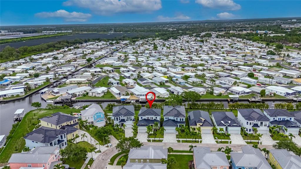 6528 Simone Shores Circle Apollo Beach, FL 33572 - Photo 93 of 98 an aerial view of a house with a lake