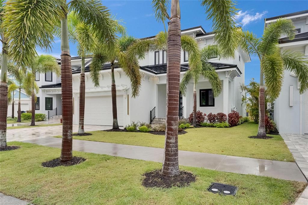 6528 Simone Shores Circle Apollo Beach, FL 33572 - Photo 10 of 98 a front view of multi story residential apartment building with yard
