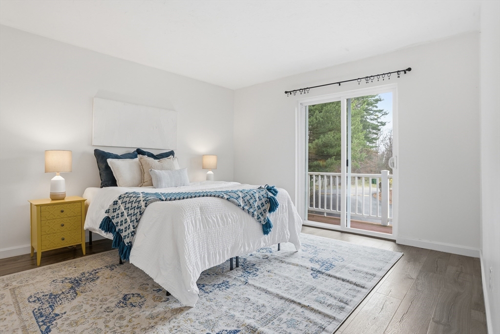 425 Main Street, Unit 22C Hudson, MA 01749 - Photo 11 of 23 a bedroom with a bed and a window