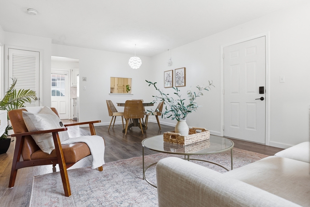 425 Main Street, Unit 22C Hudson, MA 01749 - Photo 2 of 23 a living room with furniture