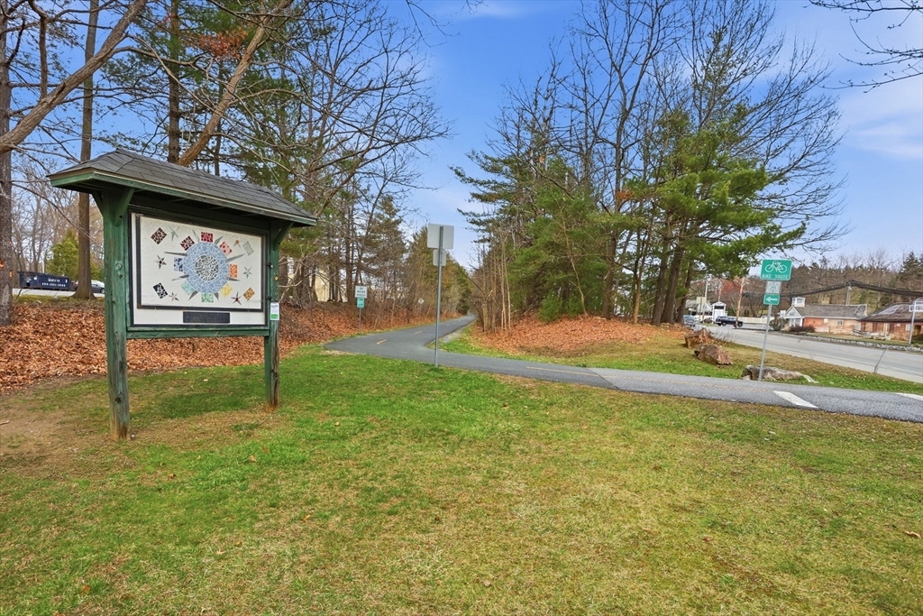 425 Main Street, Unit 22C Hudson, MA 01749 - Photo 22 of 23 a view of a house with a backyard