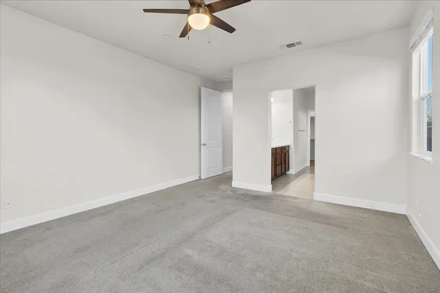 a spacious bathroom with a double vanity sink mirror and shower