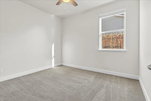 a view of an empty room and entryway