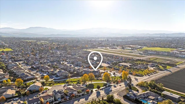 a view of a swimming pool with outdoor seating and city view